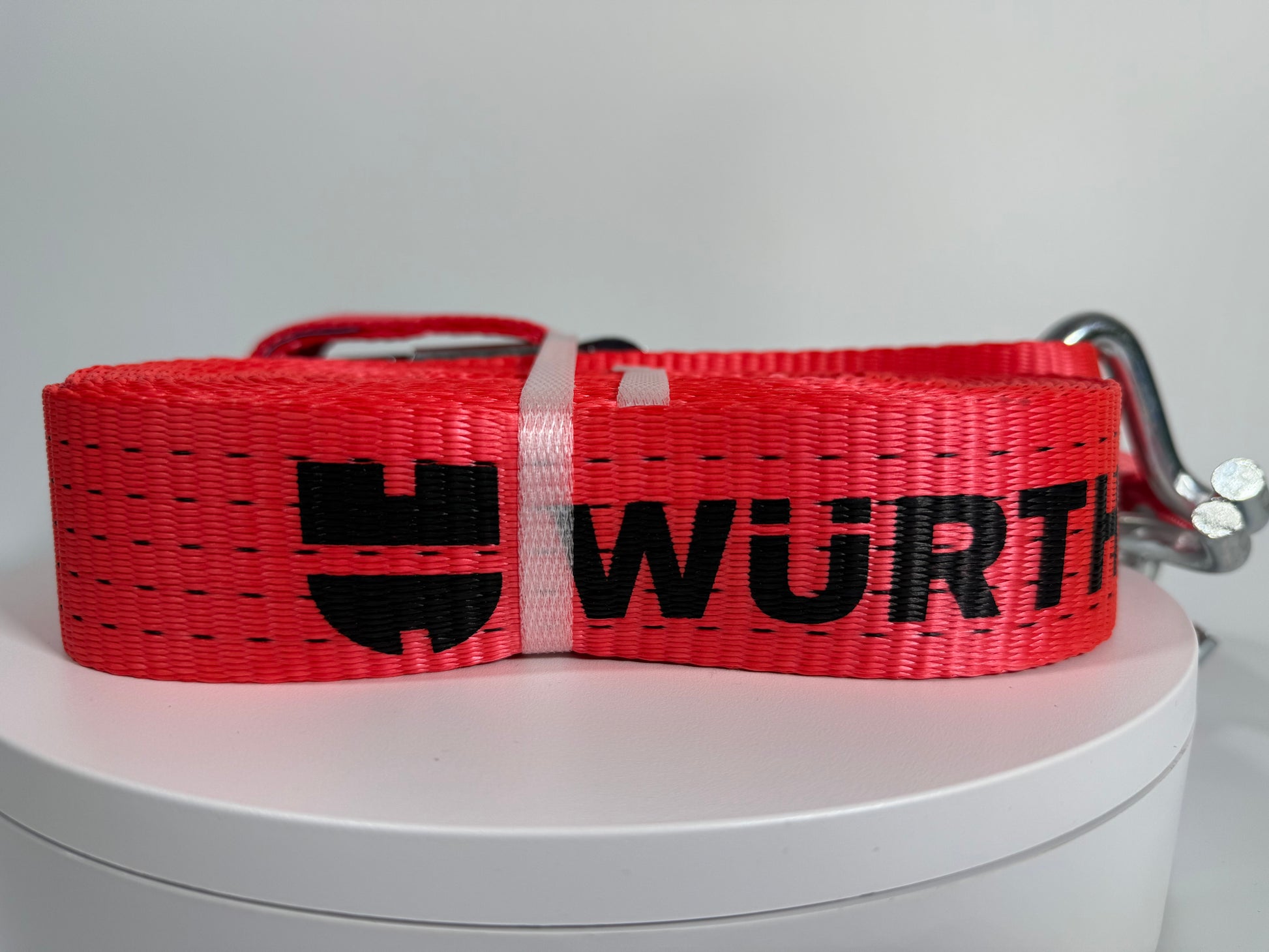 Würth Spanngurt rot mit Logo, zusammengerollt